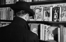 12th June 1956:  A peruser contemplates the pornography section at a Soho sex shop in London.  (Photo by John Firth/BIPs/Getty Images)